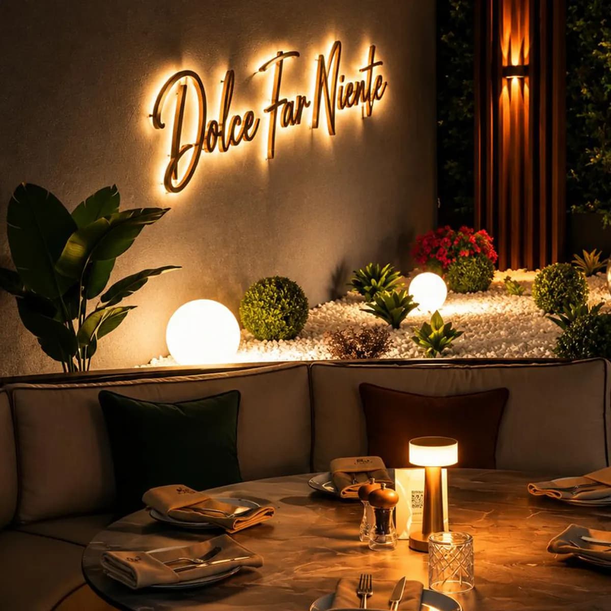 Warm D'ORO garden corner beneath the Dolce Far Niente sign