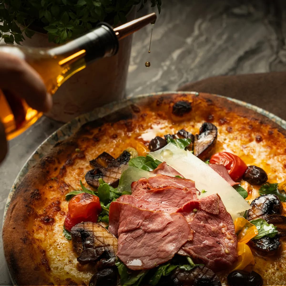 Wood-fired Neapolitan pizza topped with prosciutto and rocket