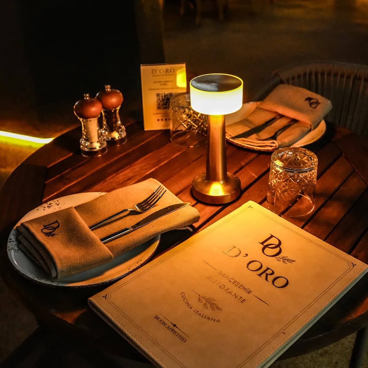 Elegant D'ORO table setting with menu and candlelight